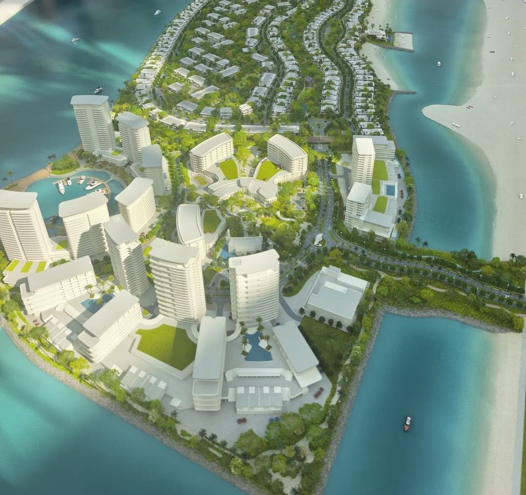 The Bay Estates marina district on Dubai Islands, with apartment towers, hotel buildings and the yacht berths